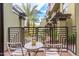 Small patio with table and chairs, offering a relaxing outdoor space at 7788 E Main St # 1002, Scottsdale, AZ 85251