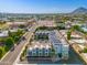 Aerial view of a modern building with city views and a surrounding neighborhood at 7788 E Main St # 1002, Scottsdale, AZ 85251