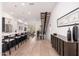 Open concept kitchen with island, stainless steel appliances, and hardwood floors at 7788 E Main St # 1002, Scottsdale, AZ 85251