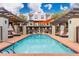 Relax by the refreshing pool with a shade sail and lounge chairs at 7788 E Main St # 1002, Scottsdale, AZ 85251