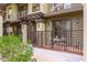 Private patio with wrought iron gate and small table at 7788 E Main St # 1002, Scottsdale, AZ 85251