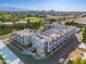 Aerial view of a modern multi-unit building, showcasing its contemporary design and surrounding cityscape at 7788 E Main St # 1002, Scottsdale, AZ 85251