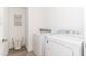 Bright laundry room with washer, dryer, and wire basket at 7788 E Main St # 1002, Scottsdale, AZ 85251