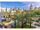 Community pool and lush landscaping with palm trees at 7788 E Main St # 1002, Scottsdale, AZ 85251