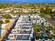 Aerial view showcasing townhomes, pool, and surrounding landscape at 7788 E Main St # 1002, Scottsdale, AZ 85251