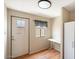 Laundry room with a closet, table, and exterior door at 9302 E Broadway Rd # 42, Mesa, AZ 85208