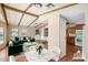 Virtually staged dining area with modern furniture and adjacent kitchen at 9302 E Broadway Rd # 42, Mesa, AZ 85208