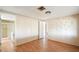 Bedroom with wood floors and adjacent bathroom at 9302 E Broadway Rd # 42, Mesa, AZ 85208