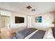 Bedroom with a large TV and en-suite bathroom at 9302 E Broadway Rd # 42, Mesa, AZ 85208