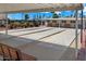 Shuffleboard court with covered seating area and palm trees at 9302 E Broadway Rd # 42, Mesa, AZ 85208