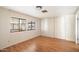 Bright bedroom with wood floors and large windows at 9302 E Broadway Rd # 42, Mesa, AZ 85208