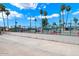 Two lighted tennis courts in a community setting at 9302 E Broadway Rd # 42, Mesa, AZ 85208