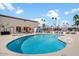 Inviting community pool with comfortable seating and palm trees at 9302 E Broadway Rd # 42, Mesa, AZ 85208