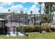 Well-maintained tennis court with benches and surrounding fence at 9302 E Broadway Rd # 42, Mesa, AZ 85208