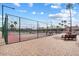 Two pickleball courts with seating areas and palm trees at 9302 E Broadway Rd # 42, Mesa, AZ 85208