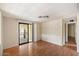 Bright dining room with wood floors and access to a patio at 9302 E Broadway Rd # 42, Mesa, AZ 85208