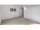 Spacious bedroom with neutral carpeting and double door closet at 12903 W Blue Sky Dr, Sun City West, AZ 85375