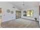 Spacious bedroom with large window and patio access at 12903 W Blue Sky Dr, Sun City West, AZ 85375