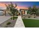Modern home exterior with a landscaped yard and walkway at 9622 W Villa Chula Dr, Peoria, AZ 85383