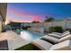 Resort-style pool and patio with lounge chairs and water feature at 9622 W Villa Chula Dr, Peoria, AZ 85383