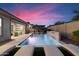 Stunning pool and spa with a waterfall feature and comfortable lounge chairs at 9622 W Villa Chula Dr, Peoria, AZ 85383