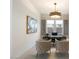 Bright home office features a large desk, two chairs, and modern art at 9622 W Villa Chula Dr, Peoria, AZ 85383