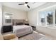 Bright bedroom with plush bed, window seat, and modern dresser at 9622 W Villa Chula Dr, Peoria, AZ 85383