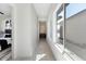 Bright hallway with natural light and modern flooring at 9622 W Villa Chula Dr, Peoria, AZ 85383