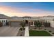 Single-story home with gray garage door and well-manicured lawn at 9622 W Villa Chula Dr, Peoria, AZ 85383