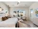 Bright main bedroom with large windows, workspace, and access to backyard at 9622 W Villa Chula Dr, Peoria, AZ 85383
