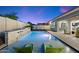 Modern pool and spa with a stone water feature and lush landscaping at 9622 W Villa Chula Dr, Peoria, AZ 85383