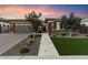 Modern home exterior with a landscaped yard and walkway at 9622 W Villa Chula Dr, Peoria, AZ 85383