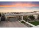 Modern home exterior with gray garage door and stone accents at 9622 W Villa Chula Dr, Peoria, AZ 85383