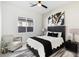 Comfortable bedroom with a queen bed and stylish decor at 9622 W Villa Chula Dr, Peoria, AZ 85383
