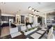 Open dining room with modern light fixtures and kitchen access at 9622 W Villa Chula Dr, Peoria, AZ 85383
