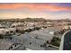 Aerial view of a luxury community, showcasing homes and mountain views at 9622 W Villa Chula Dr, Peoria, AZ 85383