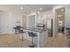 Modern kitchen with stainless steel appliances and an island at 10523 E Simone Ave, Mesa, AZ 85212