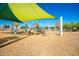 Modern playground with shade structures and play equipment at 10523 E Simone Ave, Mesa, AZ 85212