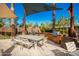 Outdoor kitchen and dining area with shade structures at 10523 E Simone Ave, Mesa, AZ 85212