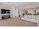 Bright and airy living room with large TV and comfortable seating at 10523 E Simone Ave, Mesa, AZ 85212