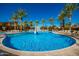 Large community pool with basketball hoop and lounge chairs at 10523 E Simone Ave, Mesa, AZ 85212
