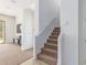Modern staircase with carpeted steps and neutral-toned walls at 10523 E Simone Ave, Mesa, AZ 85212