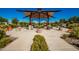 Covered seating area with tables and benches at 10523 E Simone Ave, Mesa, AZ 85212