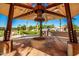 Covered firepit with seating for gatherings at 10523 E Simone Ave, Mesa, AZ 85212