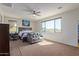 Large main bedroom with a king-size bed and ceiling fan at 10523 E Simone Ave, Mesa, AZ 85212