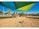 Community playground with shade structure and play equipment for children at 10523 E Simone Ave, Mesa, AZ 85212