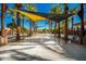 Community water feature with shade structures and seating at 10523 E Simone Ave, Mesa, AZ 85212
