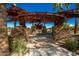 Stone gazebo with seating and a fire pit at 10523 E Simone Ave, Mesa, AZ 85212