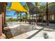 Community water feature with shade structures and seating at 10523 E Simone Ave, Mesa, AZ 85212