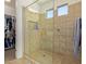 Large walk-in shower with tiled walls and glass door at 10523 E Simone Ave, Mesa, AZ 85212